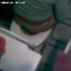 An overhead hidden camera captures the audio & visual of a woman peeing while sitting on a toilet, wiping herself (out of view), then flushing.